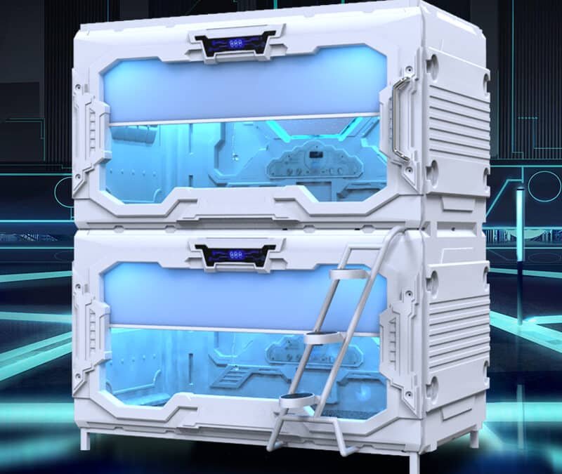 A pair of stacked, white, futuristic sleeping pods with blue interior lighting and a ladder on the right side, set in a modern, high tech environment.